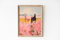 two horses are standing in the middle of a field with pink flowers and yellow grass