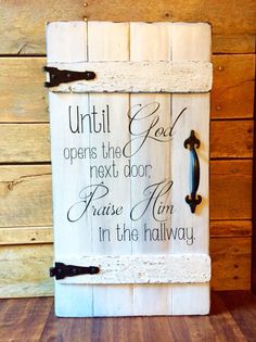 a wooden sign that says until god opens the door, please him i'm in the hallway