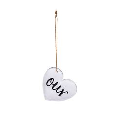 a white ornament with the word love hanging from a string on a white background