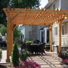 an outdoor dining area with wooden pergols and potted plants in the foreground