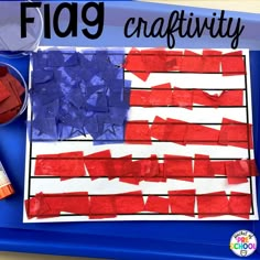 an american flag made out of red, white and blue tissue paper on a tray