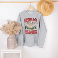 "Introducing our \"Griswold Premium Eggnog\" Unisex Sweater, the must-have addition to your winter wardrobe for fans of National Lampoon's Christmas Vacation. This cozy and hilarious sweater pays homage to the iconic Griswold family and their eggnog mishaps, making it the perfect choice for movie lovers who appreciate a good laugh. 🎄 Why Choose Our Griswold Premium Eggnog Sweater? 🍻 🌟 Hilarious Design: Featuring the Griswold family and their unforgettable eggnog incident, this sweater is a su Outfit Quotes, Crested Gecko, Retro Sweatshirts, Grandpa Sweater, Country Shirts, Mama Shirts, Screen Printing Designs, Gecko, Johnny Depp