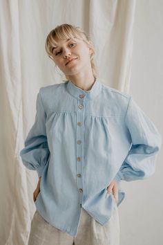 "100% linen shirt for women. A beautiful, vintage inspired linen shirt with long ruffled balloon sleeves and buttons at the front. Perfect for different looks: try wearing it with a pair of jeans for a smart look or a linen bottoms like a skirt for a romantic look. Available in sky blue and creamy white.   <> Ugnė is 180cm/5'9\" and wearing size S in Creamy White Elžbieta is 165cm/ 5'4\" and wearing size S in Sky Blue Details: - This listing is for linen shirt Indraja - Made using 100% OEKO Tex Summer Cotton Shirt With Gathered Sleeves, Relaxed Fit Puff Sleeve Shirt For Spring, Cotton Shirt With Gathered Sleeves For Spring, Linen Lantern Sleeve Tops For Summer, Casual Linen Blouse With Balloon Sleeves, Summer Linen Blouse With Puff Sleeves, Summer Linen Blouse With Gathered Sleeves, Linen Tops With Gathered Sleeves For Daywear, Summer Linen Top With Lantern Sleeves