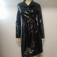 Nwot Black Trenchcoat With White Stitching. Has One Pocket On The Right Side. The Shell Is Made Of Polyurethane And The Interior Is Made Of Polyester. Black Double-breasted Party Outerwear, Spring Party Outerwear With Snap Buttons, Fitted Black Double-breasted Outerwear, Fitted Black Outerwear With Snap Buttons, Black Trenchcoat, Vinyl Jacket, Right Side, Trench Coat, Stitching