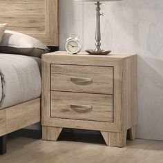 a bedroom with a bed, night stand and nightstand