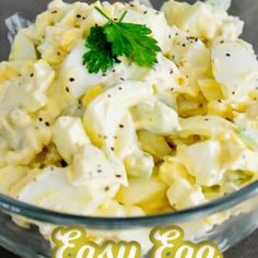 an easy egg salad in a glass bowl with parsley on top and the words easy egg salad above it