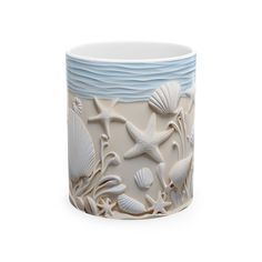 **3D Seashell Accented Ceramic Mug** Meet your next favorite morning companion: the 3D seashell accented ceramic mug. Designed to elevate your coffee or tea ritual, this mug combines style and functionality in perfect harmony. Available in two generous sizes, 11oz (0.33 l) and 15oz (0.44 l), it provides ample space for your favorite brew. Crafted from white ceramic with a sleek glossy finish, this mug features a beautifully detailed 3D seashell design that brings a touch of the ocean to your daily routine. The ergonomic C-shaped handle ensures a comfortable grip, making each sip a pleasure. Plus, the lead and BPA-free construction offers peace of mind, allowing you to enjoy your drink worry-free. Whether you're starting your day or taking a relaxing break, this seashell-themed mug is a del Beach Mug, Seashell Design, Maritime Decor, Beach Lover Gifts, Design Mug, Tea Ritual, Beach Lover, Coastal Beaches, Tea Rituals