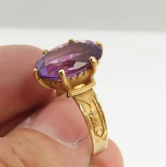 Estate 14k yellow gold large amethyst ring size 6.5. a 15mm by 10mm amethyst stone. great shape. no chips or damage. 4 grams. good size cocktail ring. Collectible Oval Amethyst Ring In 14k Gold, Antique Gold 14k Gold Amethyst Ring, Antique Gold Amethyst Ring In 14k Gold, Gold Solitaire Amethyst Ring For Formal Occasions, Formal Gold Amethyst Ring With Diamond Cut, Heirloom Gold Amethyst Ring With Center Stone, Oval Amethyst Ring With Center Stone In Gold, Oval Gold Amethyst Ring With Center Stone, Antique Gold Amethyst Ring With Center Stone