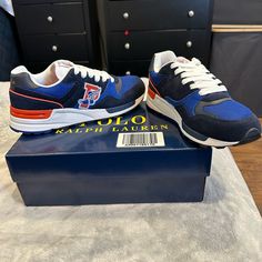 New In Box, Only Taken Out Of Plastic To Take Pics. I Would Call This A Knicks Color Pattern. Navy, Royal And Orangish. Blue Sneakers With Embroidered Logo For Casual Wear, Blue Sneakers With Embroidered Logo And Round Toe, Blue Round Toe Sneakers With Embroidered Logo, Blue Sporty Sneakers With Embroidered Logo, Blue Sneakers With Embroidered Logo, Polo Ralph Lauren Shoes, Ralph Lauren Shoes, Mens Shoes Sneakers, Blue Orange