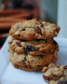 a stack of cookies sitting on top of a white plate