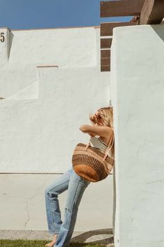 These unique sisal basket bags are the perfect everyday purse that are guaranteed to get you compliments. the unique style is inspired by vintage 1970’s basket bags jenna bee fell in love with at flea markets.    these bags are a labor of love and a beautiful blend of two cultures- kenya meets california. the sisal baskets are handmade in kenya from pure sustainably-sourced sisal fibre. the baskets are thoughtfully handmade- from harvesting the local sisal plant to crushing the leaves and extrac Casual Basket Bucket Bag For Everyday Use, Everyday Basket Straw Bag, Everyday Brown Straw Bucket Bag, Eco-friendly Everyday Basket Bag, Everyday Bucket Bag With Large Capacity, Eco-friendly Basket Shoulder Bag For Everyday Use, Everyday Large-capacity Basket Bucket Bag, Everyday Large Capacity Bucket Bag In Basket Shape, Everyday Large Capacity Basket Bucket Bag