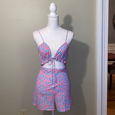 Pink Romper With Blue Flowers And Brand New With Tags. Triangle Tie Front With Elastic Cutout Band. Size Medium. Cute Matching Set Bottoms For Summer, Pink Bottoms Matching Set For Summer, Pink Matching Set Bottoms For Summer, Pink Matching Set Bottoms For Spring, Pink Romper, Pink Rompers, Blue Flowers, Pink Blue, Pant Jumpsuit