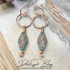 "♥ A B O U T - T H I S - D E S I G N -    These are Handmade Earrings from my Artisan Jewelry Collection - READY TO SHIP! Turquoise Boho Dangle Copper Earrings.  These earrings are made with 16 gauge Copper wire, which has been formed into a ring, hammered, bathed in patina, and polished. Suspended from the copper ring is a beautiful 19 x 14 mm Turquoise Czech Glass Arabesque Bead washed in copper. These rustic earrings are the perfect size for everyday wear dressed up or dressed down.  They are lightweight, and measure 2  1/2\" long including the hand formed copper ear wires and about 1/2\"  in diameter.  For those with sensitive ears, you have the option to select Titanium or Rhodium ear wires. These will make the perfect gift for that special lady in your life, i.e. Wives, Moms, sisters Czech Beads Jewelry, Jewlery Earrings, Hammered Copper Earrings, Tiffany And Co Jewelry, Wire Wrapped Jewelry Diy, Rustic Earrings, Turquoise Boho, Wire Wrapping Stones, Artisan Earrings