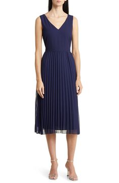 Designed in a sleeveless silhouette, this day-to-night dress is punctuated with a pleated chiffon skirt. 46" length (size 8) V-neck Sleeveless Lined 100% polyester Dry clean Imported Navy Pleated Dress, Cocktail Sleeveless Pleated Midi Dress, Sleeveless Pleated Chiffon Dress, Dressy Sleeveless Pleated Evening Dress, Pleated Sleeveless Midi Dress For Cocktail, Dressy Sleeveless Pleated Dress For Evening, Dressy Sleeveless Pleated Summer Dress, Fitted Sleeveless Dressy Pleated Dress, Dressy Sleeveless Pleated Dress