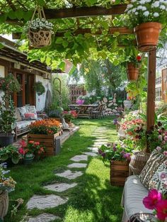 an outdoor garden with lots of flowers and plants