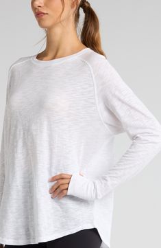 Work out or chill out in this breathable cotton top designed with sporty raglan sleeves and thumbhole cuffs. 29" length (size Medium) Crewneck Long sleeves with thumbhole cuffs 100% cotton Machine wash, tumble dry Imported Relaxed Fit Raglan Sleeve Tops For Loungewear, Everyday Athleisure Tops With Thumbholes, Relaxed Fit Raglan Sleeve Tops For Layering, Athleisure Crew Neck Tops With Thumbholes, Sporty Long Sleeve Top With Thumbholes For Spring, Athleisure Tops With Thumbholes And Crew Neck, Spring Sporty Long Sleeve Top With Thumbholes, White Stretch Long Sleeve Top For Everyday, Casual Crew Neck Activewear With Thumbholes