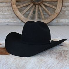 The Skyline 6x black cowboy hat is a true Stetson icon, combining legendary quality and classic Western style in a timeless package. Crafted from proprietary 6X fur felt, this hat is renowned for its durability and luxurious feel. With over 100 sets of hands involved in its production, the Skyline is built to last. This edition features a 7540 profile with a 4 5/8" cattleman crown and 4" brim, finished with a matching self-felt band and a three-piece, silver-tone buckle. A handsewn genuine leath Classic Top Hat For Western-themed Winter Events, Black Western Top Hat For Rodeo, Black Western Style Top Hat For Ranch, Black Western Top Hat For Ranch, Western Black Felt Hat For Western-themed Events, Classic Felt Hat For Western-themed Events, Western Black Felt Hat For Ranch, Classic Black Hat Bands For Ranch, Classic Black Hat For Ranch