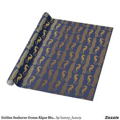 a blue wrapping paper with gold seahorses on it