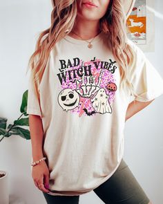 PLEASE NOTE, DUE TO THE BUSY HOLIDAY SEASON ANY ORDERS PLACED AFTER 12/09/24 ARE NOT GUARANTEED TO ARRIVE BY CHRISTMAS.Looking for a comfortable, cute fall shirt that will make you stand out from the crowd? Look no further than our Comfort Colors witch t-shirt! Give it as a gift to your friends and family this fall season, or wear it yourself to show your support for all things Halloween. Comes in multiple colors! Check out more designs here: www.etsy.com/shop/jadeandroseshop ✨️SIZE AND FIT: You Cute Halloween Tops With Funny Print, Cute Halloween Tops With Custom Print, Cute Halloween Custom Print Tops, Halloween Cartoon Print Relaxed Fit Tops, Cute Custom Print Tops For Halloween, Novelty Character Print Tops For Fall, Cute Halloween Shirt With Graphic Print, Cute Halloween Graphic Print Shirt, Fun Fall Graphic Print Shirt