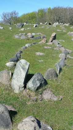 large rocks in the middle of a grassy field