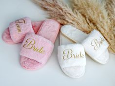 three slippers with the word bride written on them next to some dried grass and feathers