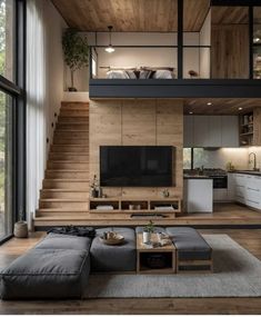 a living room filled with furniture and a flat screen tv on top of a wooden wall