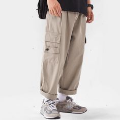 Experience timeless style and versatility with our Classic All-Match Straight-Leg Cargo Pants. Made with high-quality materials, these pants offer a comfortable fit and effortless elegance. With their straight-leg design and functional cargo pockets, they are perfect for any occasion. Elevate your wardrobe with this luxurious and essential piece. Features: -85% Cotton,15% Polyester -Mid-rise waist -Multi-Pockets -Regular Fit -Japanese style