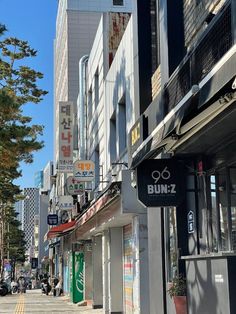 a city street with buildings and signs on it