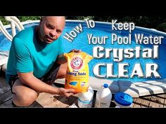 a man sitting on a wooden deck next to a swimming pool holding a bag of crystal clear