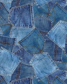 many blue jeans are stacked together on top of each other, with the same pattern