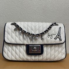 $248 Karl Lagerfeld Agyness Eiffel Tower Shoulder Bag White Navy New Twist-Lock Closure Blacktone Hardware One Outside Back Slip Pocket One Inside Zip Pocket One Inside Slip Pocket Lined Polyurethane Trim Textile Imported Dimensions: 10.5" W X 6" H X 2.5" D New With Tags Msrp: $248.00 100% Authentic See Pictures For Details. Item Is Sold As Is. Color May Differ In Actuality Due To Lighting. Thank You For Visiting My Store. Please Feel Free To Ask Any Questions. Designer White Flap Bag With Detachable Strap, Luxury White Flap Bag With Top Handle, Luxury White Top Handle Flap Bag, Luxury White Flap Shoulder Bag, Luxury White Shoulder Flap Bag, White Luxury Satchel Flap Bag, Luxury White Crossbody Flap Bag, Luxury White Satchel Flap Bag, White Formal Flap Bag With Branded Hardware