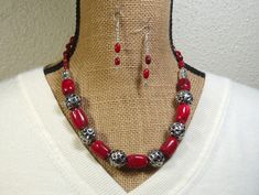 "Natural AAAGrade Quality Red Coral 7x10mm on the Necklace Straps, 16mm up to 18mm Long Coral in the Necklace Body, with .925 Silver Beading and Clasp Necklace and Earrings Handmade by me, \"Limpin' Lizard\". This Silver Hook and Eye Clasp necklace is 20\" inches long but can be made longer by using the 3\" Silver Extention Chain (chain can be removed if buyer prefers), or shortened if buyer prefers. Earrings are available with your choice of Silver French Wire Hooks (as shown), Silver Leverback Red Oval Beads Jewelry For Gift, Red Oval Beads Jewelry, Red Gemstone Beads Sterling Silver Jewelry, Red Sterling Silver Jewelry With Gemstone Beads, Necklaces Red, Beaded Jewelry Designs, Dragonfly Pendant, Clasp Necklace, Free Earrings