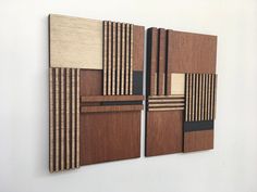 two pieces of wood are arranged on the wall