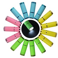 a circular arrangement of different colored flashlights on a white background