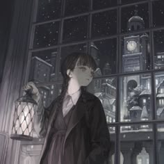 a woman standing in front of a window at night