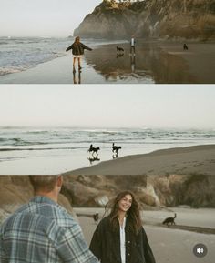 two people are walking on the beach with their dogs and one person is holding his arms out