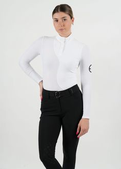 a woman in white shirt and black pants