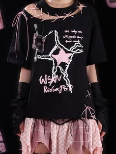 Embrace the perfect blend of edgy and cute with our Black and Pink Lace-up Detail Graphic T-shirt. This unique piece features a striking graphic design that captures attention, while the lace-up details add a touch of feminine flair. Garment Size SizeS-MM-LFull Length6570Bust112116Shoulders5354Sleeve Length2222.5 Spring Grunge T-shirt For Alternative Fashion, Alternative Graffiti Print T-shirt For Summer, Emo Style Short Sleeve Summer Tops, Emo Short Sleeve Tops For Summer, Emo Style Short Sleeve Tops For Summer, Edgy Graphic Tops For Summer, Edgy Graphic Design Tops For Summer, Edgy Summer Tops With Graphic Design, Summer Emo Style Short Sleeve Tops