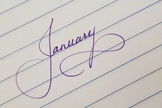 the word january written in cursive writing on lined paper