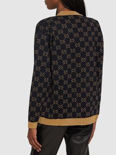 Deep v neckline. Front button closure. Contrasting color ribbed trim. All over pattern placement may vary. Two front pockets. Model is wearing a sizeM Versace Brand, Gucci Outfits, All Over Pattern, Flat Espadrilles, Swim Accessories, V Neckline, Heeled Loafers, Shearling Jacket, Ski Wear