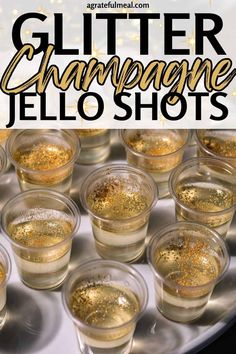 glasses filled with glitter champagne jello shots on top of a white tray and the words glitter champagne jello shots above it