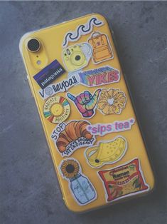 an iphone case with various stickers on it