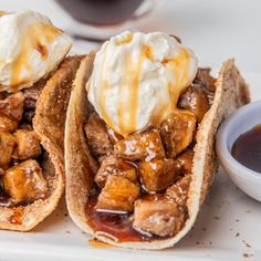 two tacos with ice cream and caramel sauce