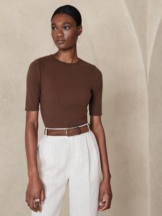 A classic staple in every wardrobe, a soft cotton fabrication comes to life with a softly fitted bodice and elbow-length sleeves.  SEMI-FITTED: Cut for a not-too-tight, not-too-loose fit.  Crew neck.  Straight hem.  Semi-fitted.  Elbow-length sleeves Classic Fitted T-shirt For Fall, Casual Fitted T-shirt With 3/4 Sleeves, Classic Fitted Short Sleeve Top For Work, Classic Half Sleeve Tops With Relaxed Fit, Classic Fitted Spring T-shirt, Classic Fitted T-shirt For Spring, Spring Classic Fitted T-shirt, Classic Scoop Neck Top For Work, Classic Scoop Neck Top For Workwear