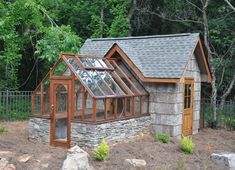 a small house made out of stone and wood