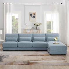 a living room with a blue sectional couch