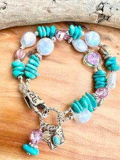 This boho bracelet is so fun!  It is made with the prettiest robins egg blue shade of turquoise. It is natural and never dyed. It is combined with  faceted Czech crystal  and has Bali style spacers. It also has  creamy white coin pearls. It has a cool crystal heart bead as well.  The bracelet closes with a silver plated fancy oversized lobster clasp It also has a sterling and turquoise artisan butterfly charm. Bracelet measures approximately 7 1/2 inches long and has 2 strands. Adjustable Turquoise Bohemian Pearl Bracelet, Bohemian Pearl Bracelet With Natural Stones, Bohemian Turquoise Pearl Bracelet With Round Beads, Turquoise Bohemian Pearl Bracelet, Bohemian Turquoise Pearl Bracelet For Gift, Handmade Blue Bohemian Pearl Bracelet, Bracelet Mexican, Bracelet Butterfly, Butterfly Charm Bracelet