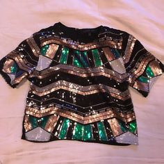 Beautiful Sequin Shirt Size Small. Never Worn. Short Sleeve Tops For Night Out Party Season, Short Sleeve Tops For Party Season, Multicolor Festive Tops For Fall, Black Sequined Crew Neck Top, Chic Short Sleeve Party T-shirt, Black Crew Neck Top With Sequins, Chic Short Sleeve Tops For Party Season, Green Top For Night Out Party Season, Festive Green Sequin Tops