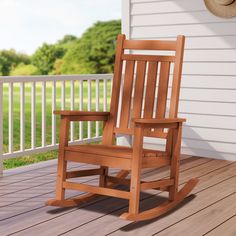 a wooden rocking chair sitting on top of a porch