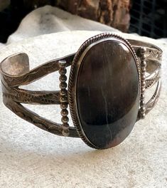 Beautiful 1940s Navajo Sterling Silver Petrified Wood Native American Vintage Cuff Bracelet Face of the stone measures over 1 3/4 inches tall I have left its natural patina but would polish up nicely weighs 40 grams Southwestern Brown Jewelry With Patina, Brown Southwestern Jewelry With Patina, Southwestern Style Brown Bracelet Jewelry, Southwestern Style Brown Bracelet, Adjustable Antique Concho Jewelry, Antique Adjustable Concho Jewelry, Artisan Brown Untreated Jewelry, Brown Rustic Jewelry With Patina, Rustic Brown Patina Jewelry